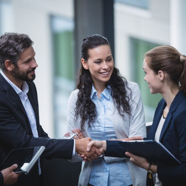 businesspeople-having-discussion-office